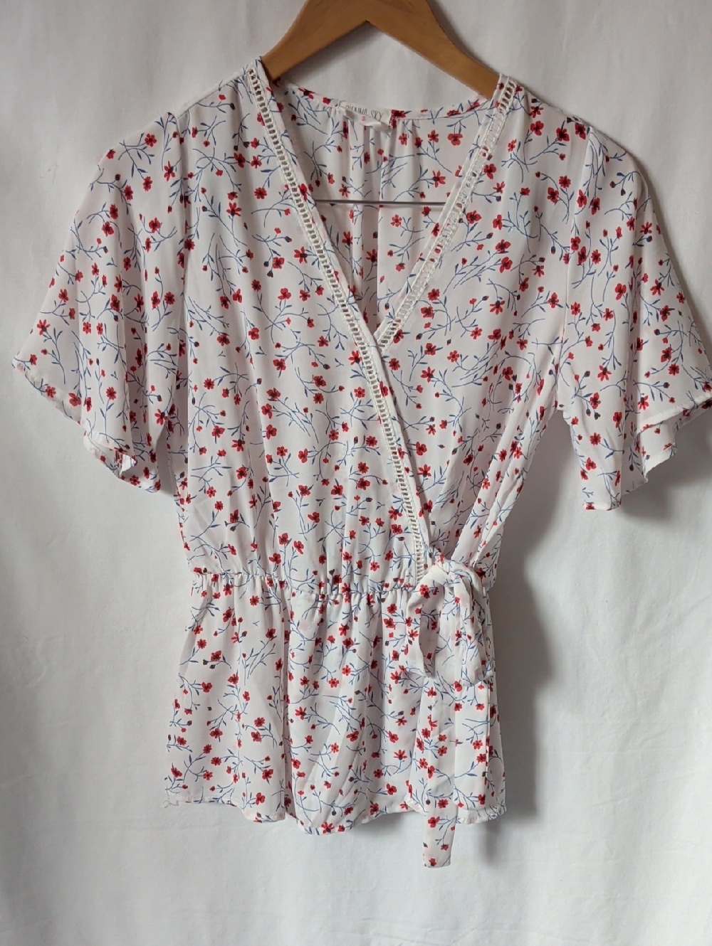 Sienna Sky White Faux Wrap Top with Red Floral Print